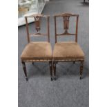 A pair of Edwardian bedroom chairs