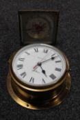 A brass ship's style clock and a further dressing table clock