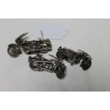 Three continental miniature silver motorbikes,