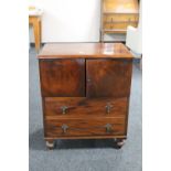 An Edwardian mahogany storage cabinet