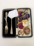 A silver fork and spoon, gilt metal Steward medals,