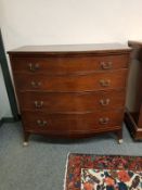 A George III bow fronted mahogany four drawer chest,