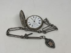 A large heavy antique silver Hunter pocket watch on heavy antique Albert chain
