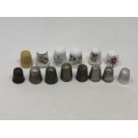 A group of fourteen thimbles including two hallmarked silver examples by Charles Horner (14)