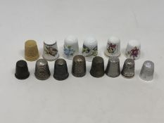 A group of fourteen thimbles including two hallmarked silver examples by Charles Horner (14)