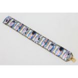 A Norwegian silver gilt and enamel panel bracelet, depicting winter and coastal landscapes,