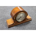 An inlaid mahogany mantel clock