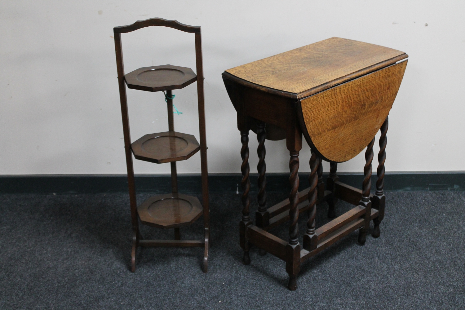 An Edwardian oak gate leg table and a mahogany cake stand