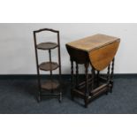 An Edwardian oak gate leg table and a mahogany cake stand