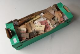 A box of bus and travel tokens from the early 20th century