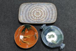Three pottery glazed plates