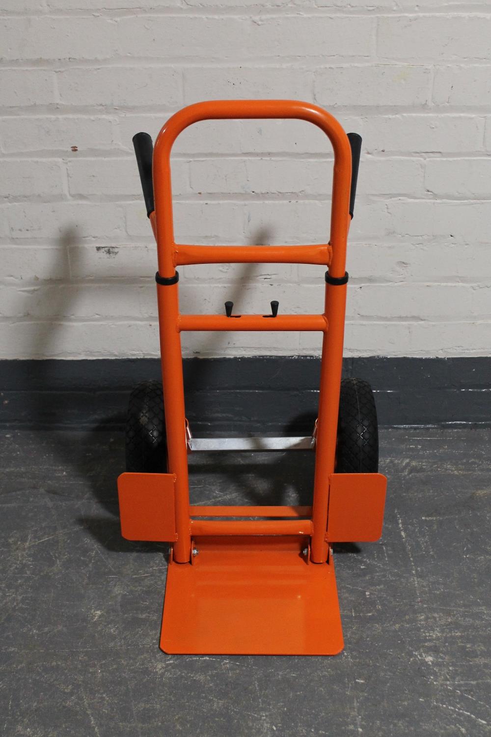 A twin handled adjustable sack barrow on spring axle