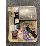 A tray of costume jewellery, lacquered trinket box, wristwatches,