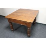 An Edwardian oak dining table