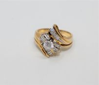 A 14ct gold diamond set ring, the principal diamond weighing an estimated 0.