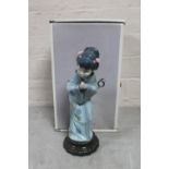 A Lladro figure of a Geisha crouching