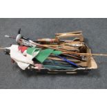 A box of squash rackets, parasols,