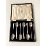 Six cased silver teaspoons