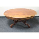 An antique style carved low table