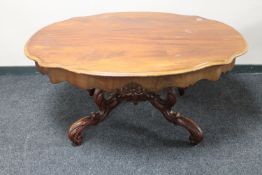 An antique style carved low table