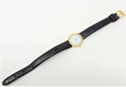 A lady's 18ct gold Omega De Ville wristwatch, on leather strap.