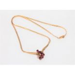 A fine quality 18ct gold ruby and diamond necklace, 12.4g.