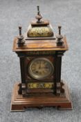 A continental inlaid stained beech wood bracket clock