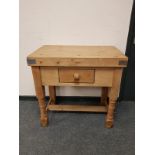 A pine butcher's block fitted a drawer,