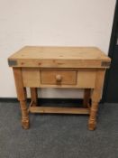 A pine butcher's block fitted a drawer,