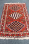 A Persian rug of geometric design,