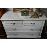 A white marble topped Edwardian four drawer chest
