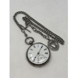 An antique silver pocket watch on heavy silver Albert
