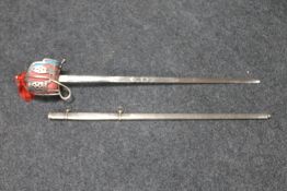 A basket hilted sword in scabbard CONDITION REPORT: Blade 80cm. In good condition.