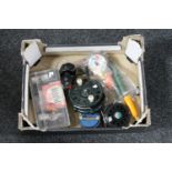 A box of fishing reels,