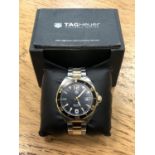 A gent's Tag Heuer stainless steel and yellow gold Formula 1 quartz calendar wristwatch, ref.