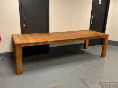 A large hardwood plank topped dining table, 100 cm x 277 cm.