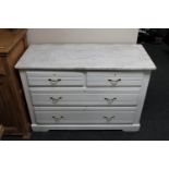 An antique pine painted four drawer chest with marble top