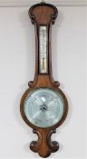 A mahogany cased barometer with silvered dial