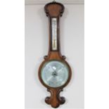 A mahogany cased barometer with silvered dial