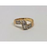 An 18ct gold diamond set crossover ring, size K1/2. CONDITION REPORT: 3.6g.
