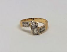 An 18ct gold diamond set crossover ring, size K1/2. CONDITION REPORT: 3.6g.