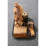 A tray of wooden pieces to include a biscuit barrel, carved table box, letter rack,