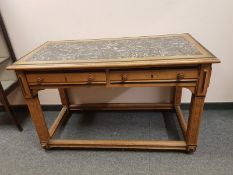 An inlaid oak two drawer side table with granite top,