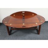 A mahogany butler's tray coffee table on stand