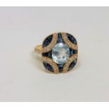 A 14ct gold aquamarine, sapphire and diamond ring, the aquamarine weighing 2.