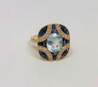 A 14ct gold aquamarine, sapphire and diamond ring, the aquamarine weighing 2.