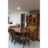An eight piece Ducal pine dining room suite comprising of dresser,