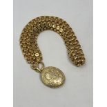 A Victorian gold locket on contemporary chain CONDITION REPORT: 42.8g.