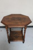 An Edwardian carved oak octagonal occasional table