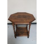 An Edwardian carved oak octagonal occasional table